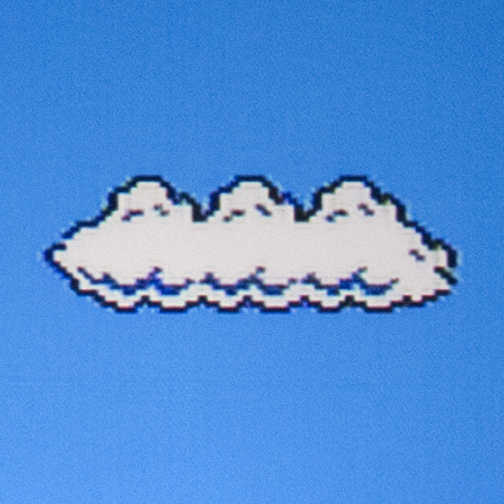 Fig. 3 Photograph of the projected image as played out from NES. The blue background shows a light structure, the black contour is thicker. Photo: Emilie Magnin. Courtesy of the Migros Museum für Gegenwartskunst.